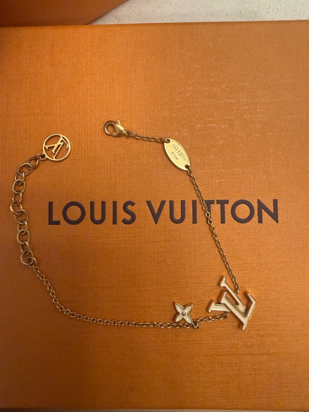 Louis Vuitton Gold-Tone LV Charm White Enamel Bracelet - Picture 4 of 6